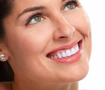 Image of lady smilling with having brighter & white teeth